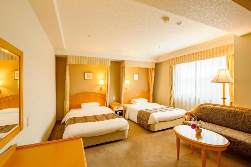 Katil atau katil-katil dalam bilik di Kanazawa Hakuchoro Hotel Sanraku -Natural Hot Spring-
