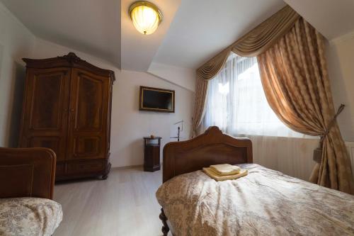 Postel nebo postele na pokoji v ubytování Ikonomov House