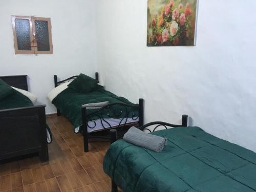 Ένα ή περισσότερα κρεβάτια σε δωμάτιο στο Dar El Karam