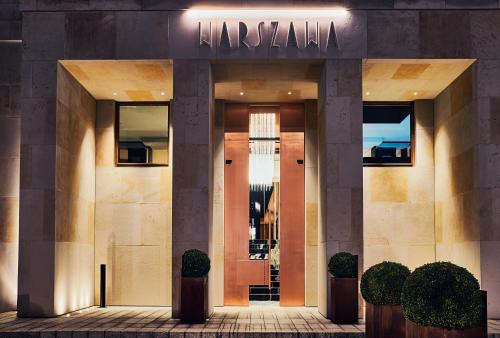 a store front of a building with a sign on it at Hotel Warszawa in Warsaw