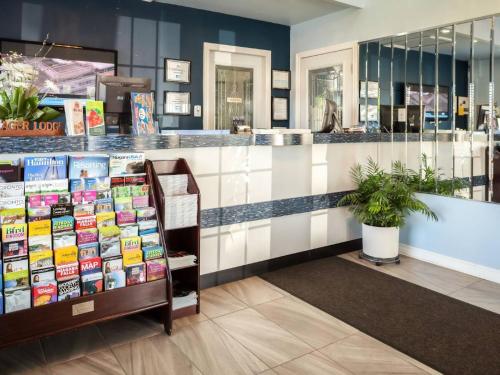 a store with a counter with books on it at Villager Lodge Niagara Falls in Niagara Falls