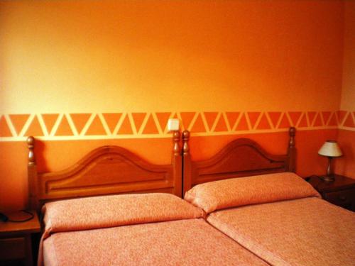 Letto o letti in una camera di Núcleo de Turismo Rural Valle de Iruelas