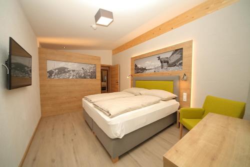 Кровать или кровати в номере Appartementhaus Burgfried