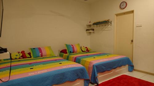Кровать или кровати в номере Vista Alam Roomstay Homestay