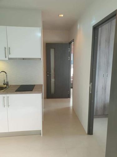 a kitchen with a sink and a counter in a room at Grandblue condominium Room 606 in Mae Pim