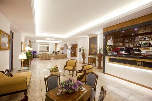 a living room with a lobby with a bar at Baia D'Argento in Porto Santo Stefano
