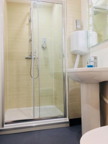 a bathroom with a shower and a sink at Hotel Express Newcastle Gateshead in Newcastle upon Tyne
