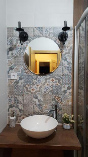 a bathroom with a white sink and a mirror at Lumer in Kolašin