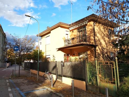a house with a fence in front of it at Villa Al Sole in Mestre