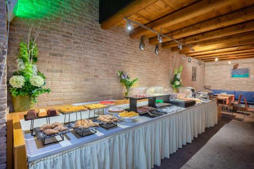a buffet line with many different types of food at Eurostars Residenza Cannaregio in Venice