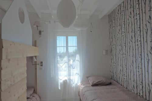 Katil atau katil-katil dalam bilik di Belval Cottages