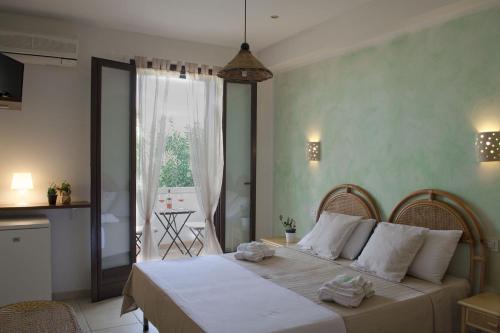 Postel nebo postele na pokoji v ubytování Residence Borgo Latino- Localo