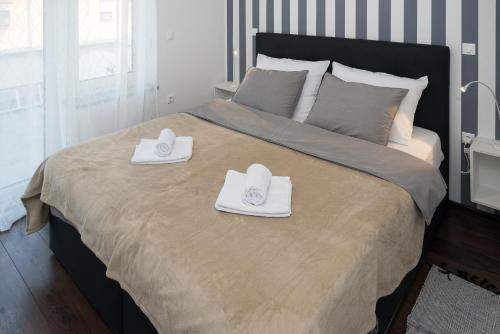 Postel nebo postele na pokoji v ubytování Apartman MIA