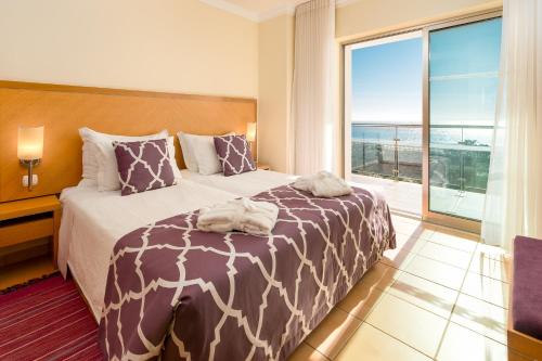 Кровать или кровати в номере Hotel Apartamento Dunamar