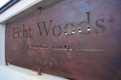 a sign that says eight wolves laboratories on the side of a building at Echt Woods Appartements in Söll