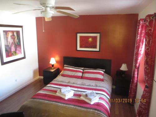 a bedroom with a bed with two books on it at Park-View Sleeps 12 3BR in Union City