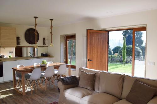 a living room with a couch and a table at Villa Margaridi in Guimarães