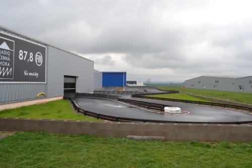 a roundabout on a track in front of a building at Penzion V Podzámčí Litomyšl in Litomyšl
