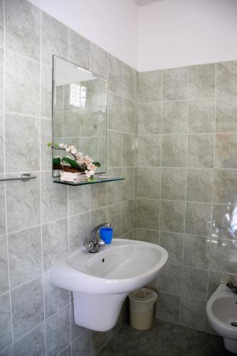 a bathroom with a sink and a mirror at Hotel Ristorante Da Marco in San Mauro a Mare
