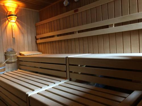 a sauna with a bench in a room at Hotel HAAS in Bad Gastein