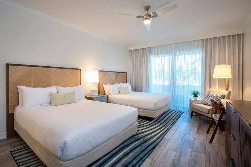 a hotel room with two beds and a window at Hawks Cay Resort in Marathon