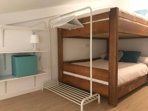 Ένα ή περισσότερα κρεβάτια σε δωμάτιο στο Ginebra Deluxe Domus parking-wifi