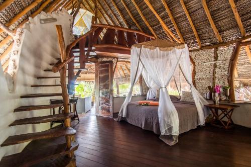 Postel nebo postele na pokoji v ubytování Ninamu Resort