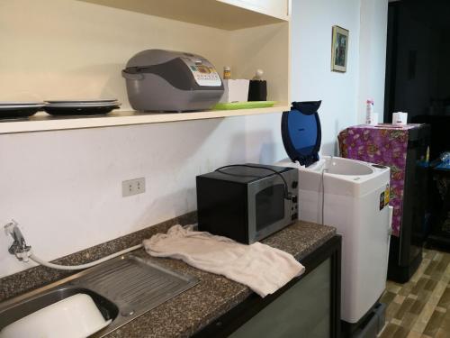 Kuchyň nebo kuchyňský kout v ubytování Jomtien Hill Resort Pratamnak