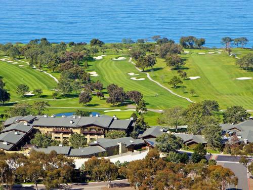 an aerial view of the golf course at the oceanfront resort at The Lodge at Torrey Pines in San Diego