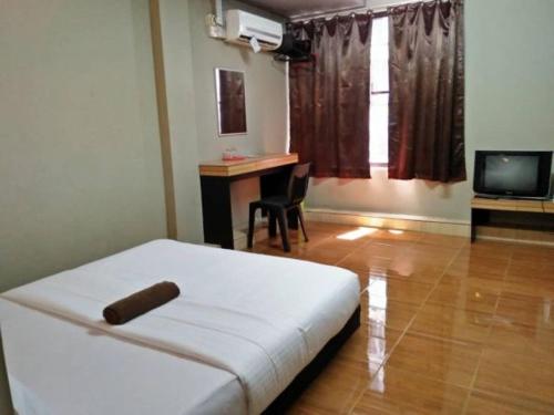 Televiisor ja/või meelelahutuskeskus majutusasutuses Qing Yun Rest House Gadong 1st branch