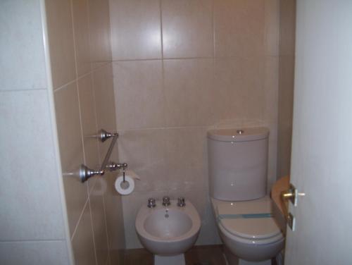 a bathroom with a toilet and a sink at Apolo Atlantis in Mar del Plata