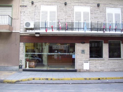 a building with flags in the window of a store at Apolo Atlantis in Mar del Plata