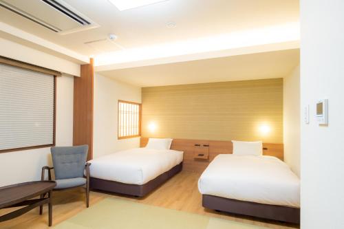 Hotel Munin Furanoにあるベッド