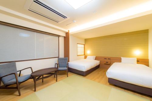 Hotel Munin Furanoにあるベッド
