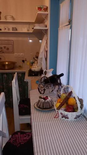 a table with a plate of food on top of it at Nino's House in Tsinandali