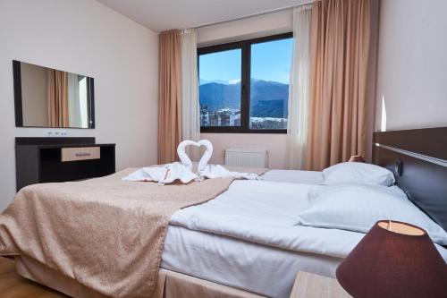 Ένα ή περισσότερα κρεβάτια σε δωμάτιο στο Sunrise Park Complex - Free Wellness