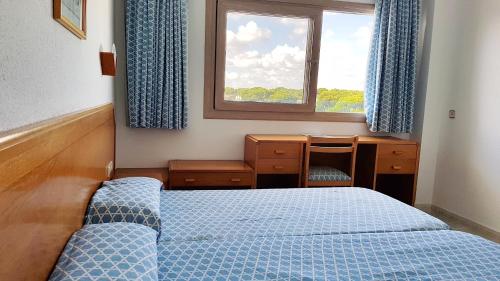 Postel nebo postele na pokoji v ubytování STIL MAR Y PAZ