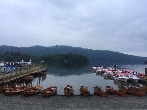 a group of boats parked next to a dock at Windermere Lynwood Guest House in Windermere