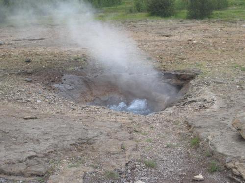 a fire pit with steam coming out of it at Kerbyggd: Luxury house and cottage in golden circle in Selfoss