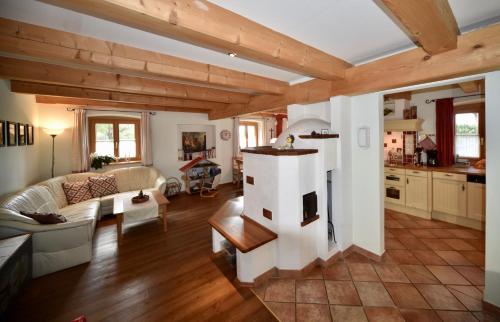 a living room with a fireplace in a house at Vitalhof Roithinger in Grieskirchen