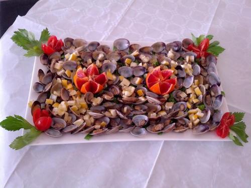 a plate of beans and tomatoes on a table at Hotel Ristorante Da Marco in San Mauro a Mare