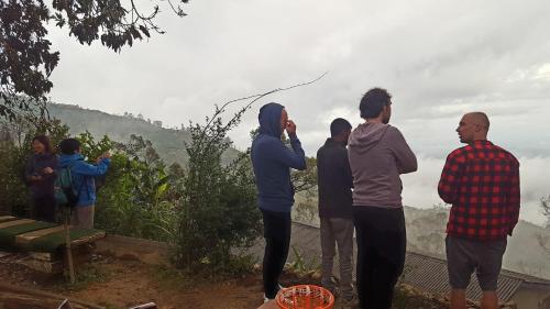 a group of people standing on top of a mountain at Bel View Guest House in Haputale