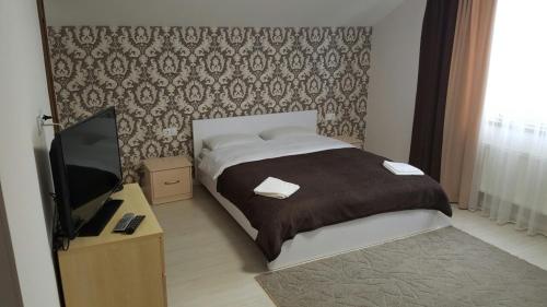 En eller flere senge i et værelse på Krashanka