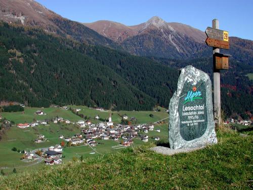 a sign on the side of a mountain with a village at Gästehaus Ortner in Liesing