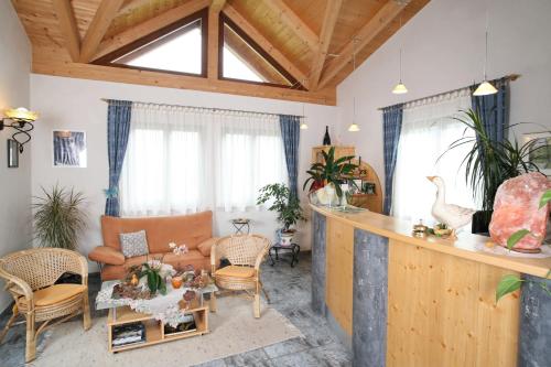 a living room with a couch and a table at Gästehaus Ortner in Liesing