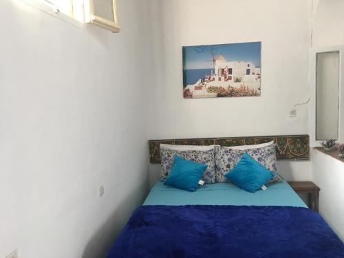 Säng eller sängar i ett rum på Dar El Karam