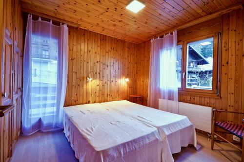 Postel nebo postele na pokoji v ubytování Charmant appartement entièrement équipé à Champéry