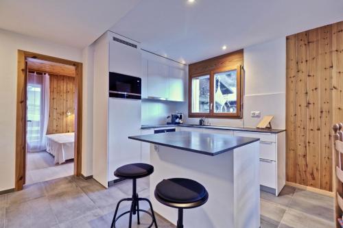 Kuchyň nebo kuchyňský kout v ubytování Charmant appartement entièrement équipé à Champéry