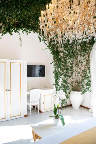a living room with a large chandelier at Villa Yiara in Positano