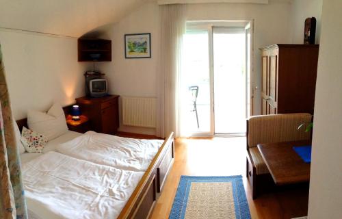 En eller flere senger på et rom på Apartments Urschitz